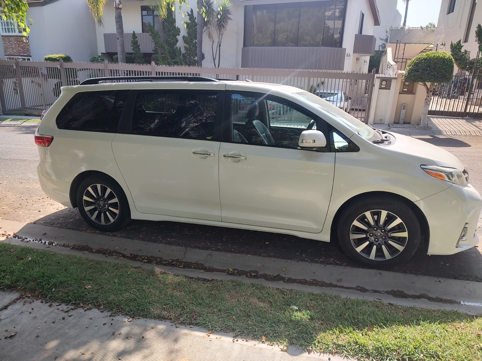 Side view of an Orellis Toyota Sienna minivan.